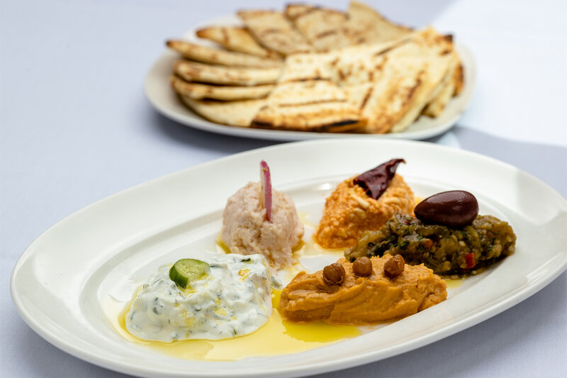 Pita bread with plated spreads