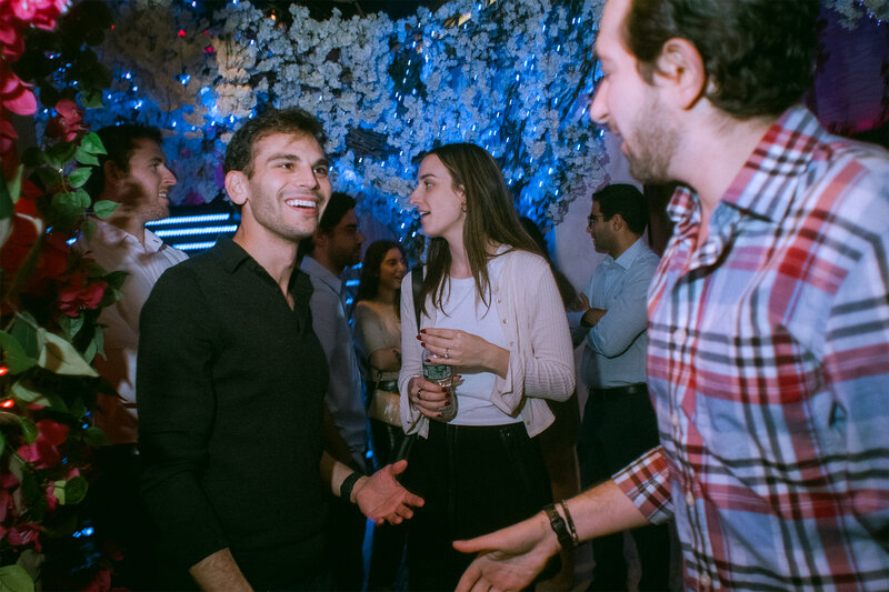 Two restaurant guests smiling at each other