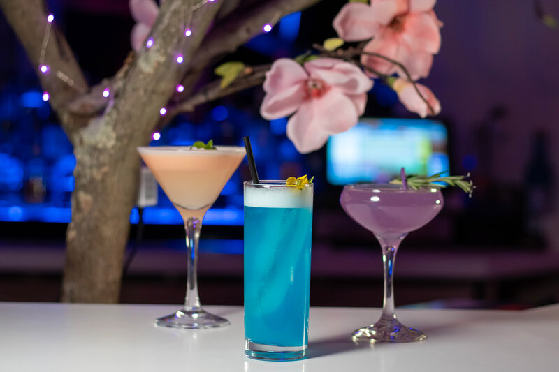 Three cocktails on bar top