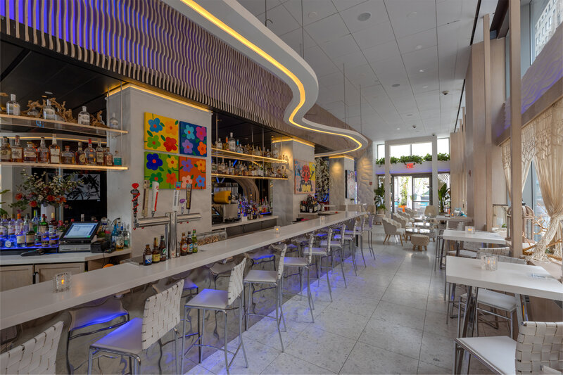 Bar area with stool seating and hightop tables